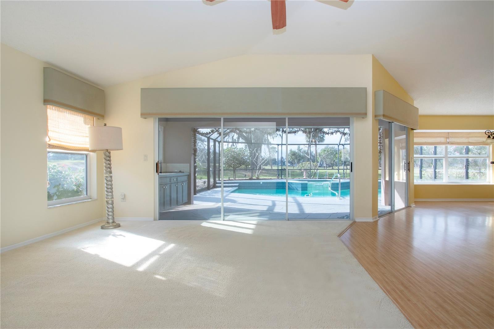 Enter into the Living Room w/view of Pool