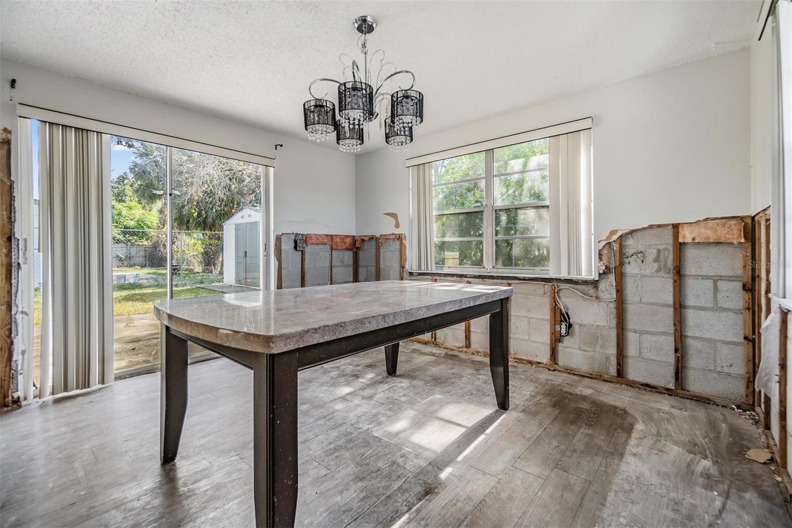 Dining room with slider doors.  Possible 3rd bedroom.