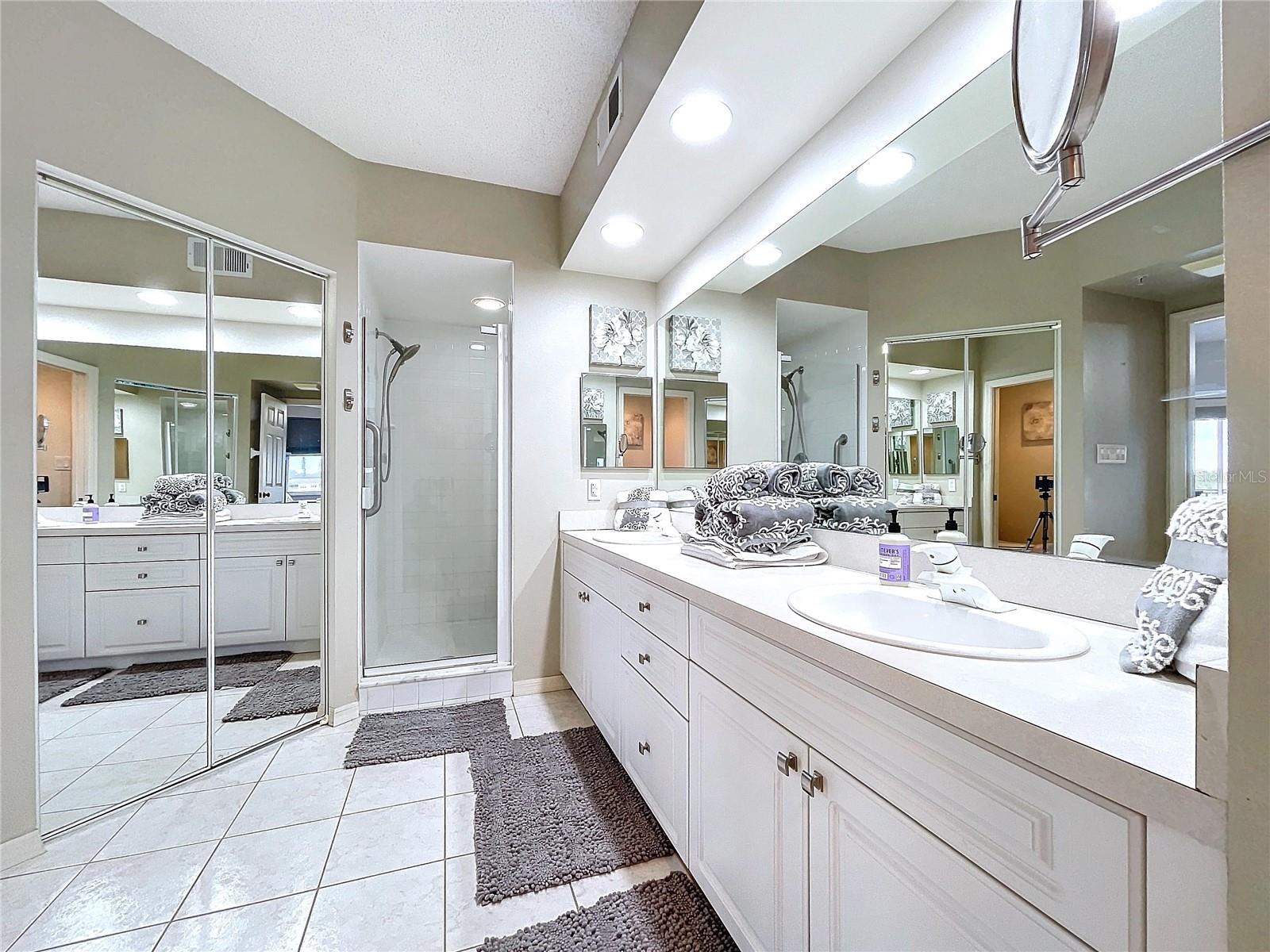 The Primary bathroom offers dual sinks, separate water closet, two walk-in closets and shower with glass door.