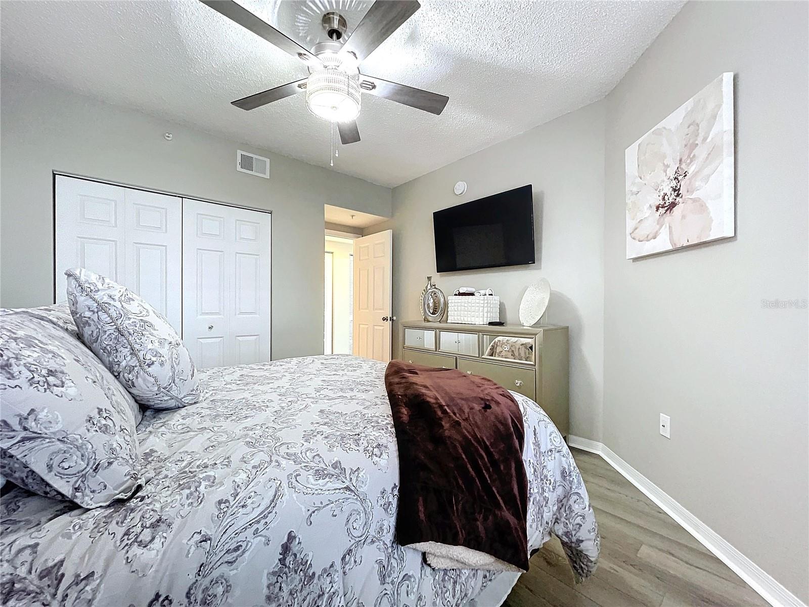 The 2nd bedroom also offers natural lighting and LVT flooring.