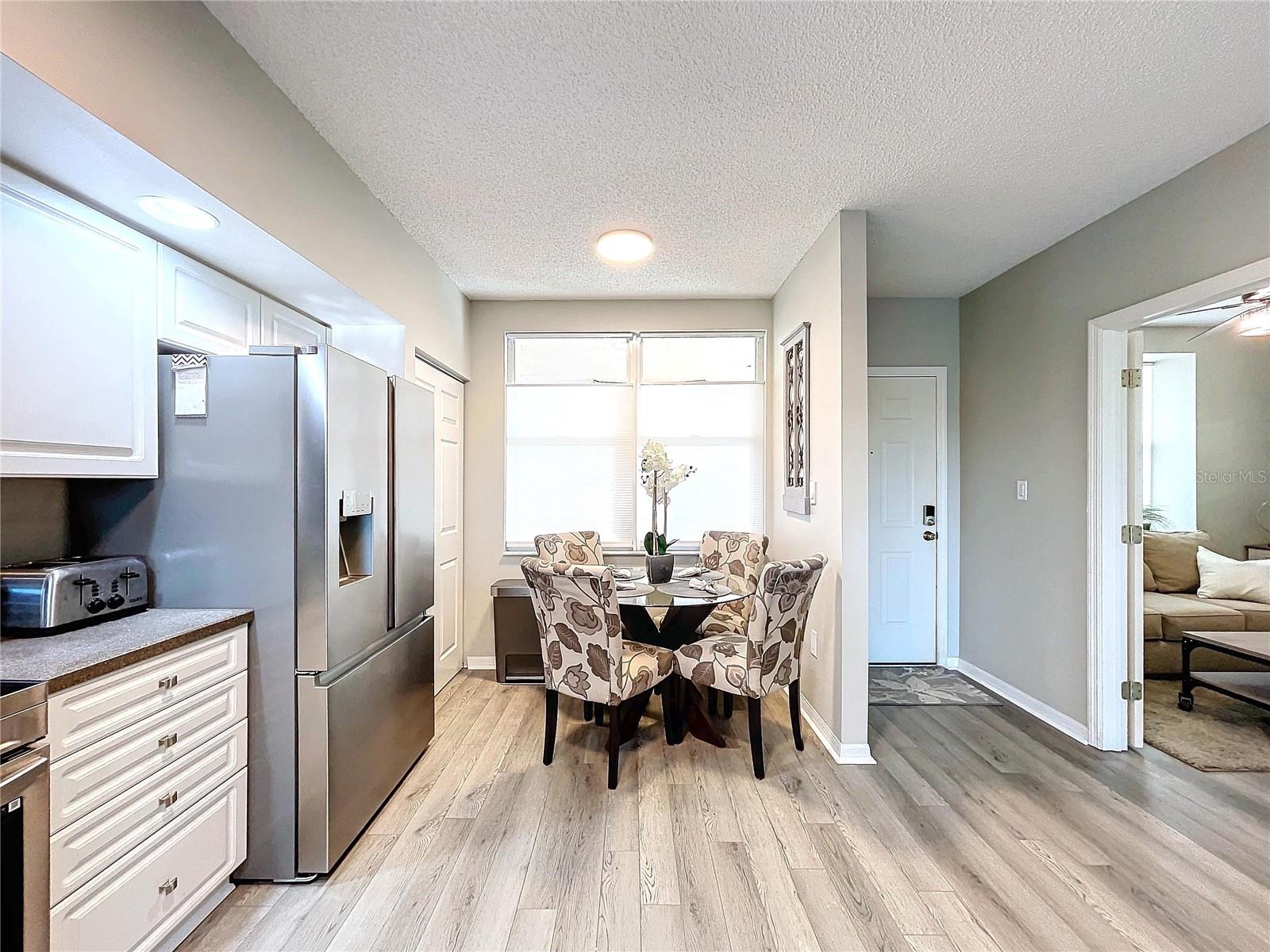 Kitchen features a closet pantry and breakfast table space.