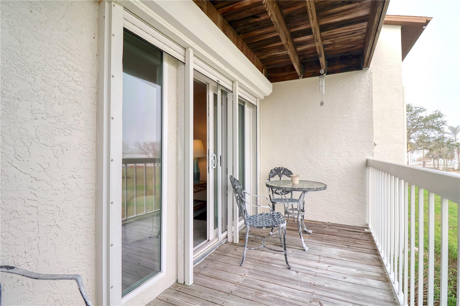 Living room balcony with view of tennis courts