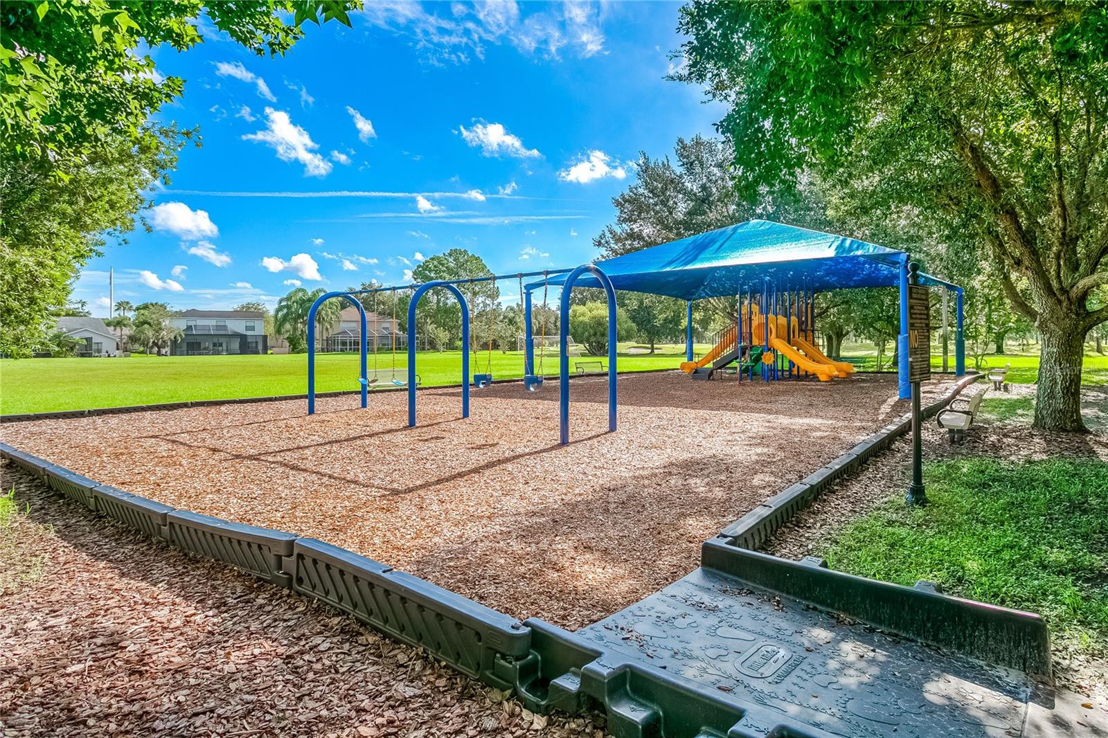 Countryway Park - view 1 of covered playground and swing set