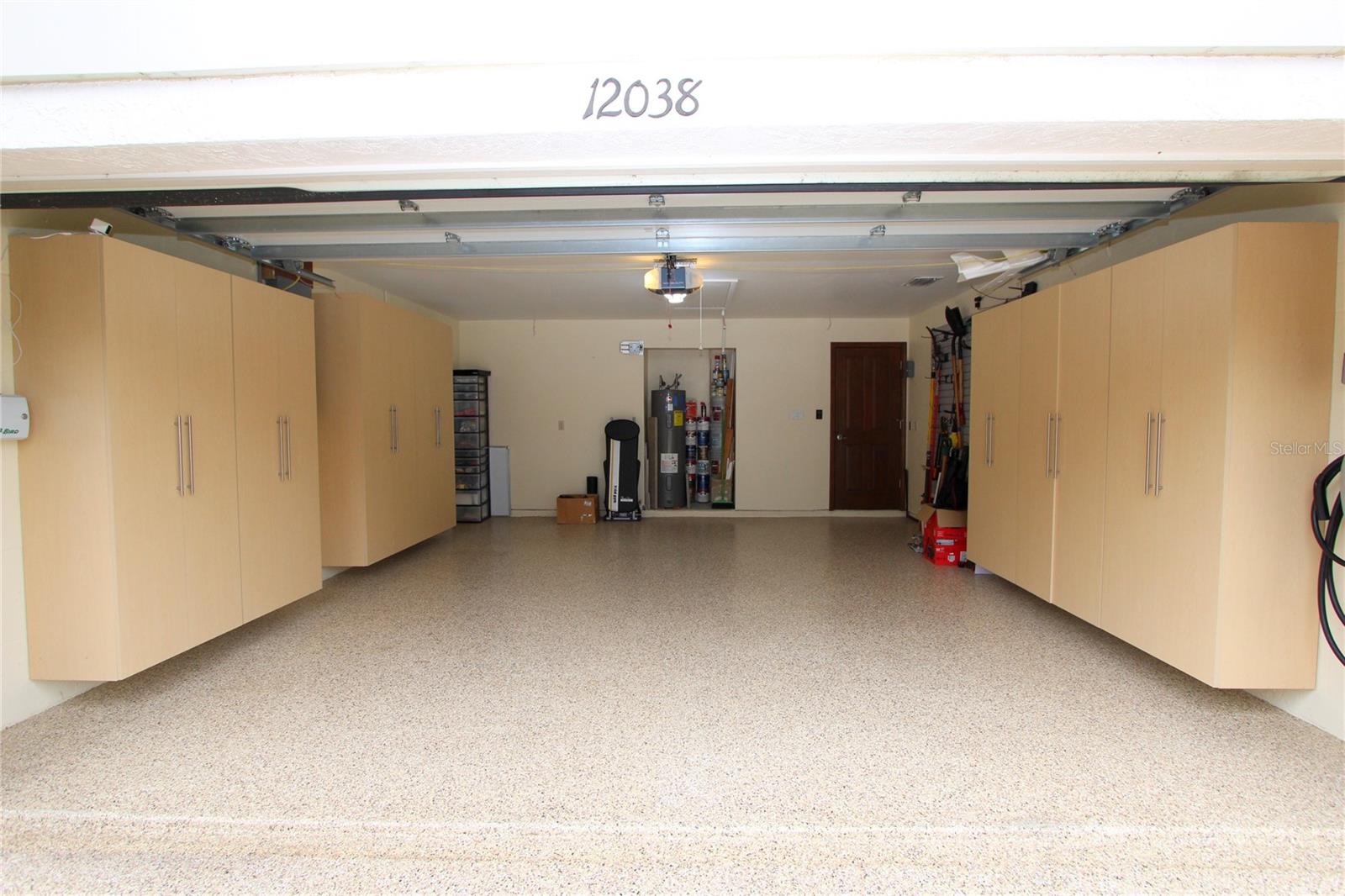 Spotless garage with Polyaspartic floor and MEGA built in storage!