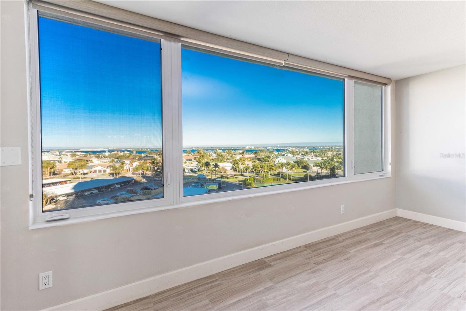 LIVING ROOM AREA OVERLOOKING EASTERN WATER VIEWS, SUNRISE, DUNEDIN, AND MORE