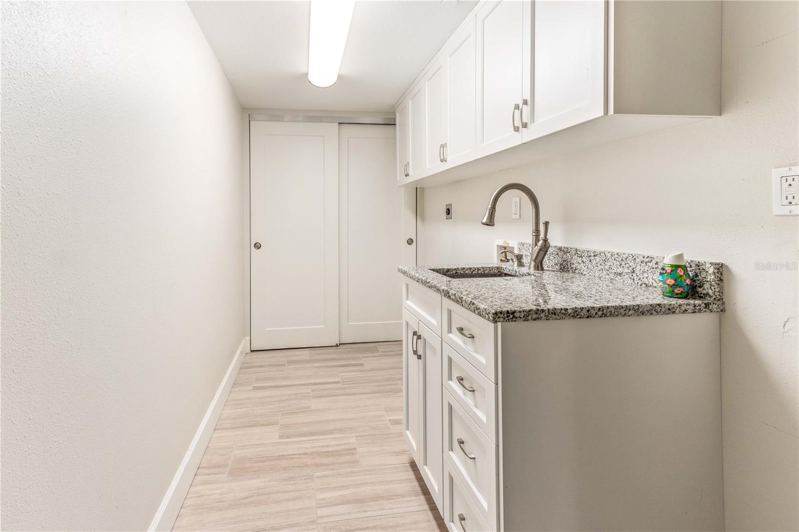 LAUNDRY ROOM WITH WASHER AND DRYER HOOKUPS