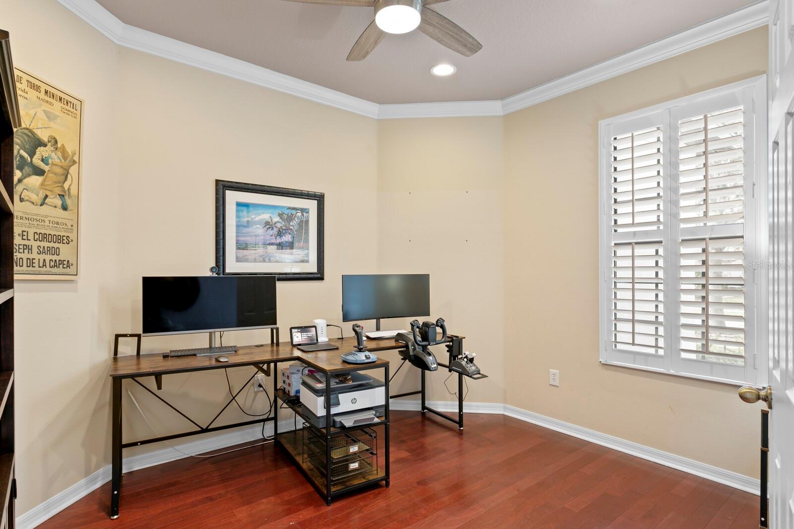 Private home office with French doors and hardwood floors