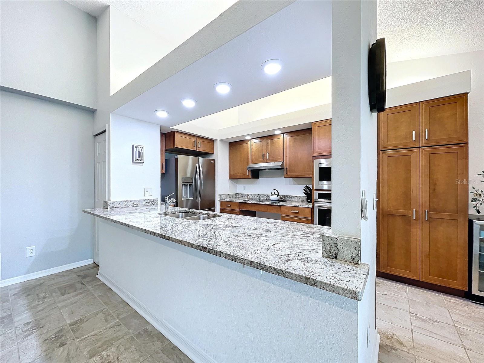 Open concept kitchen with area for barstools.