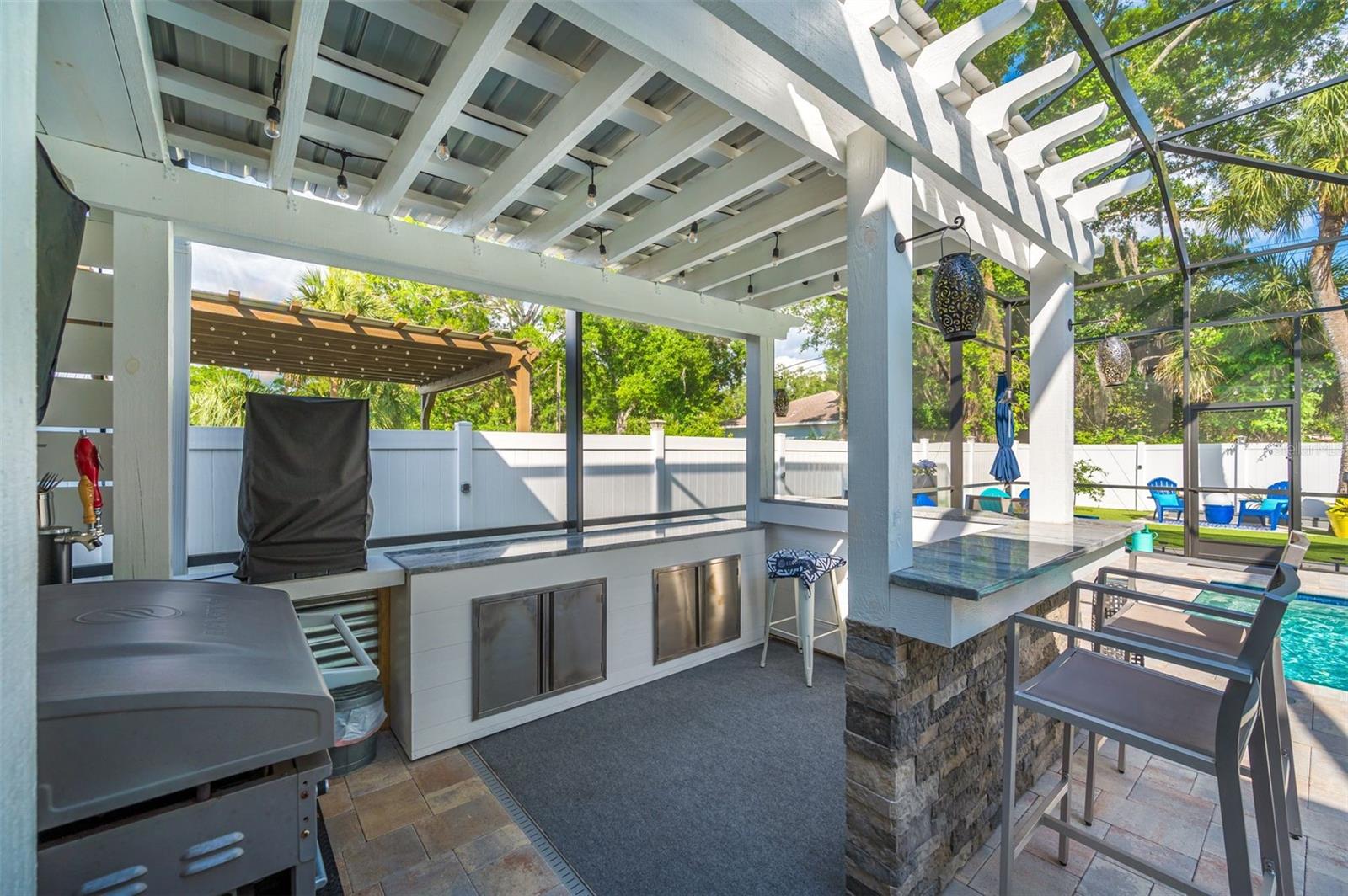 outdoor kitchen/pergola area