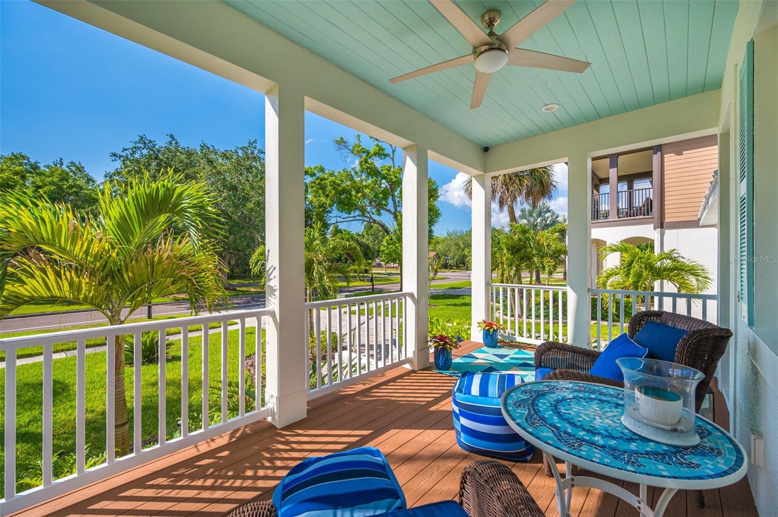 Front porch has upgraded railing system, composite flooring, and plank ceiling