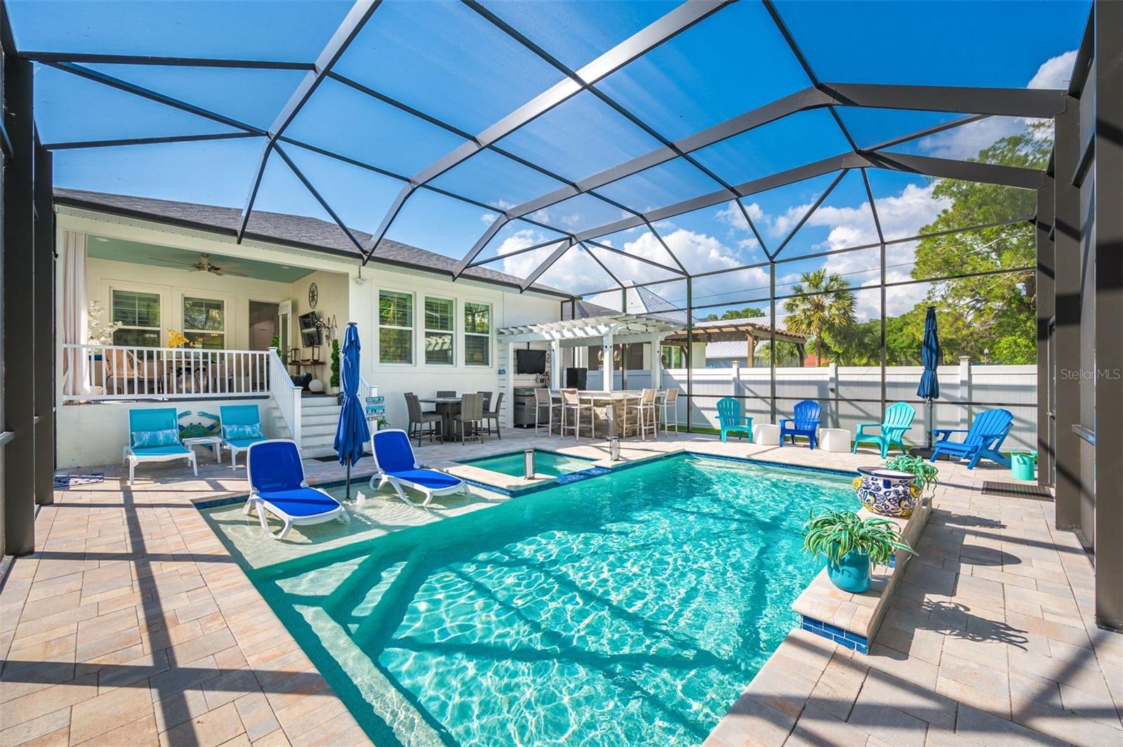 pool has waterfall and hot tub