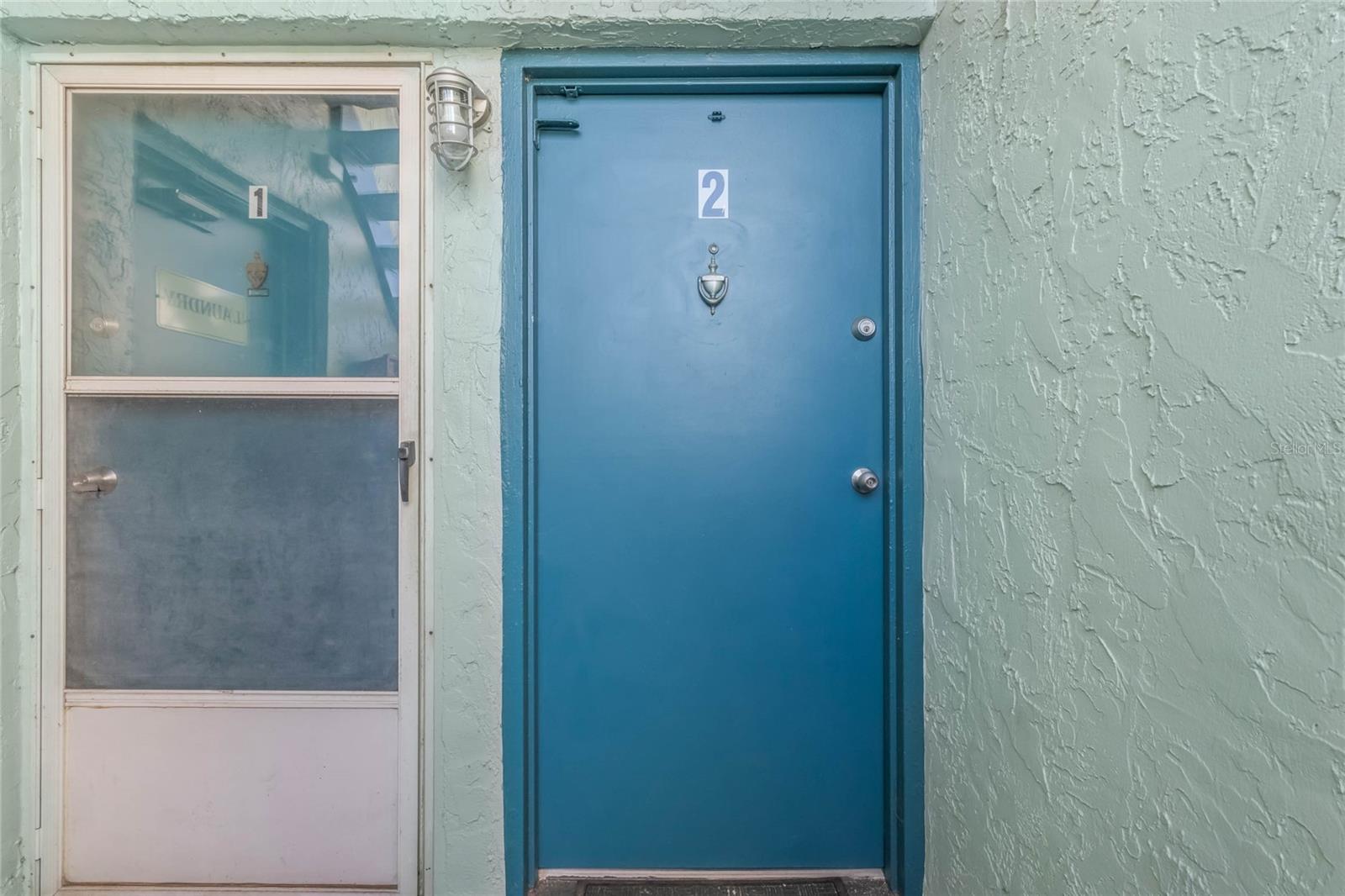 Front Door (Community laundry room located directly to the left)