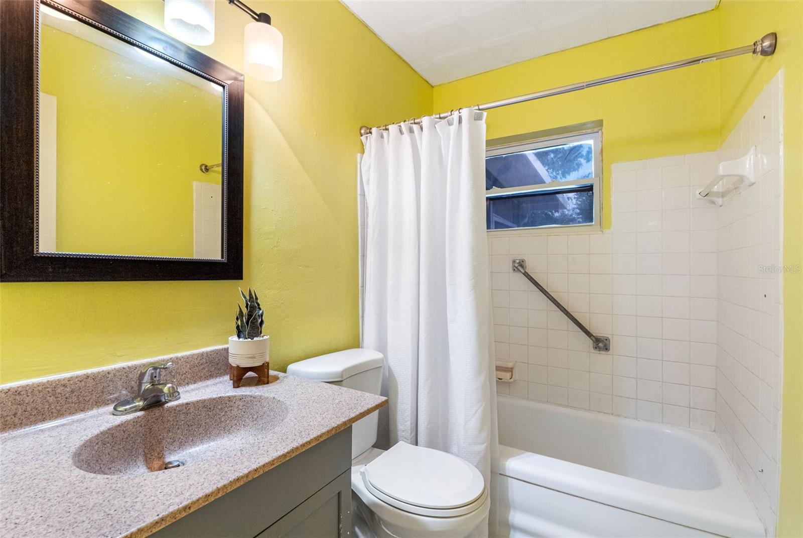 Bathroom with updated vanity.