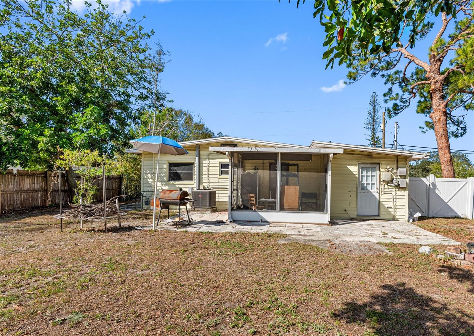 Extra convenience! The backyard features a storage shed, orange tree, and double-gate access for all your outdoor needs.