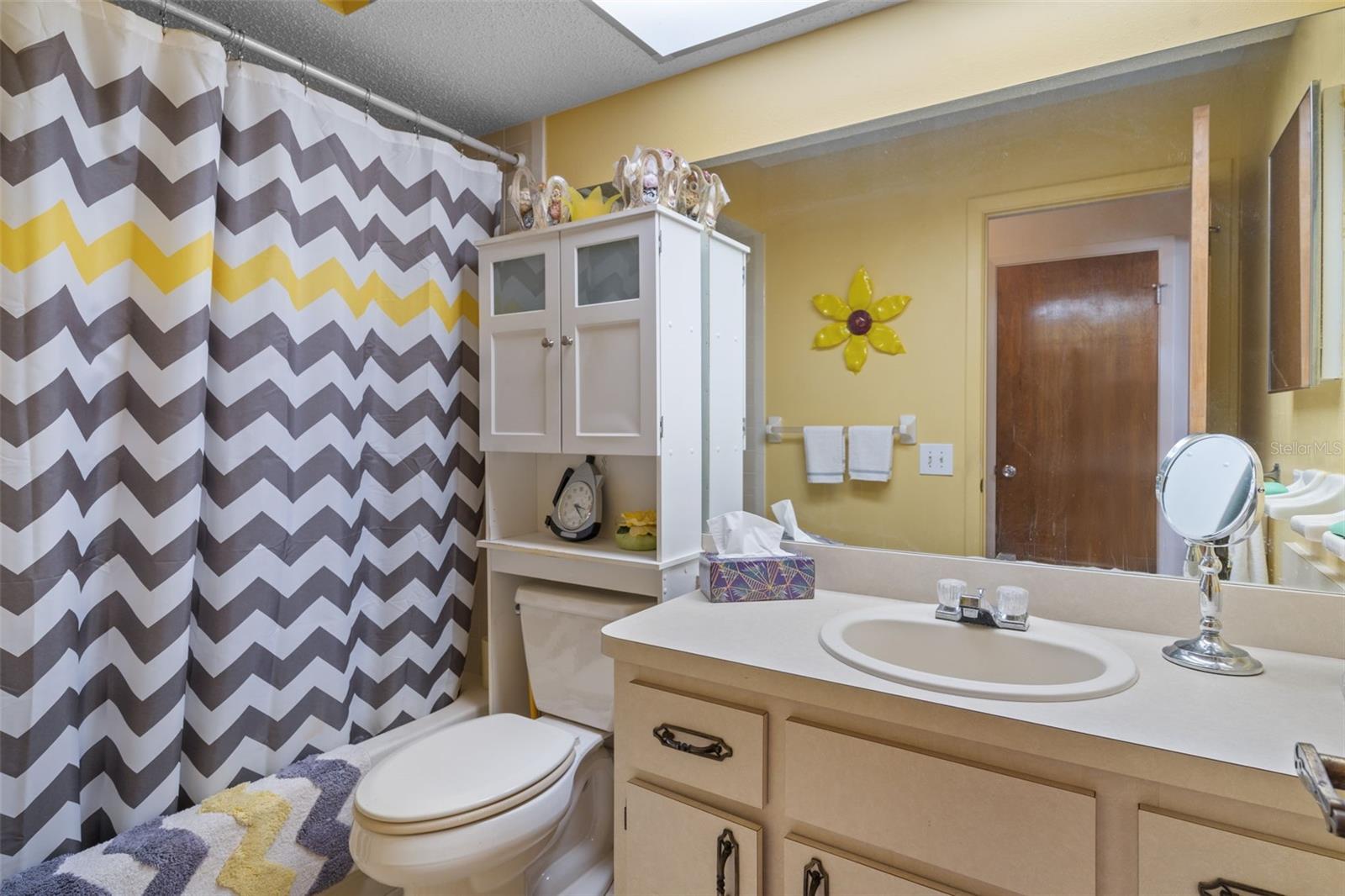 Guest Bathroom with a Tub/Shower Combo