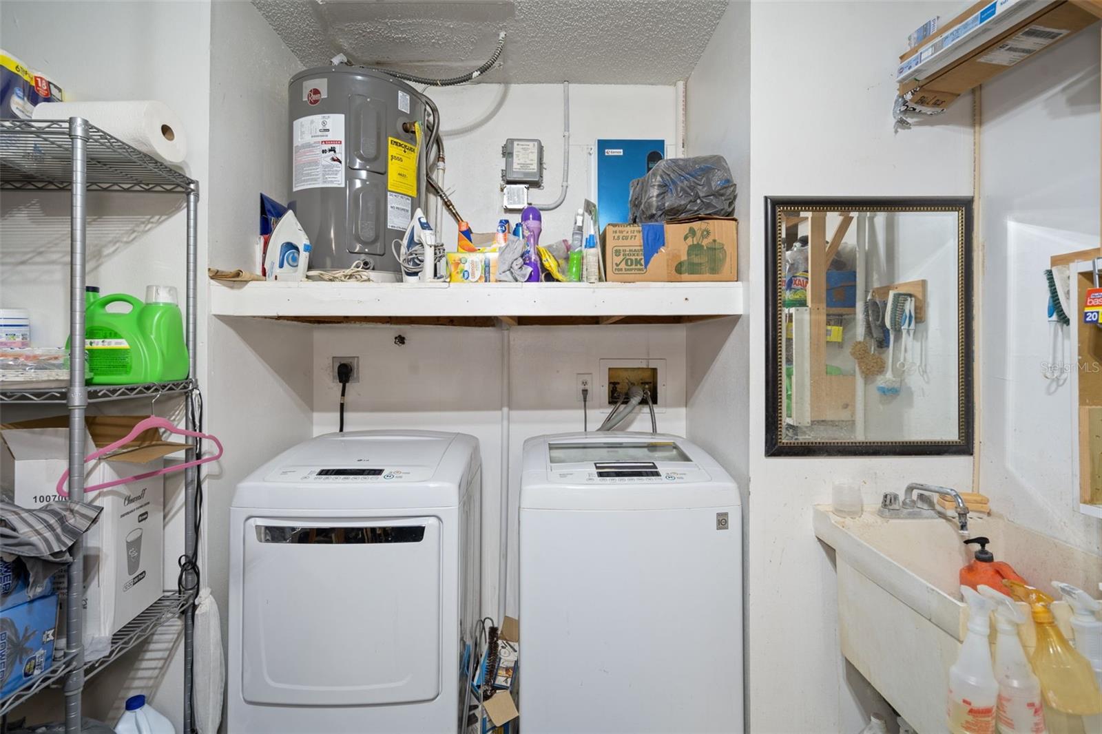 Washer and Dryer do stay with the home. There is a tankless hot water heater and another hot water heater too !!