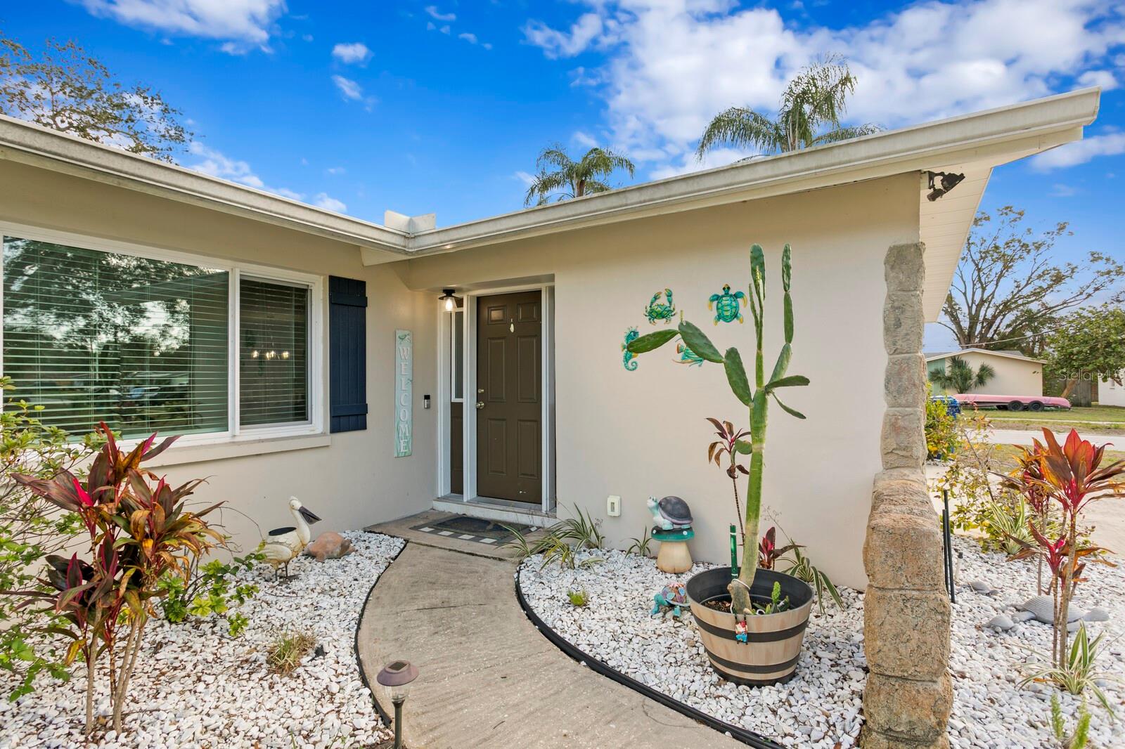 Tropical landscaping and a welcoming entryway