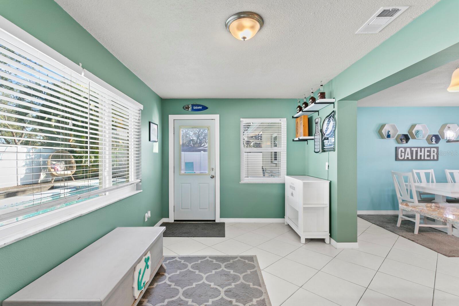 Door from the Florida room leads out to the private pool