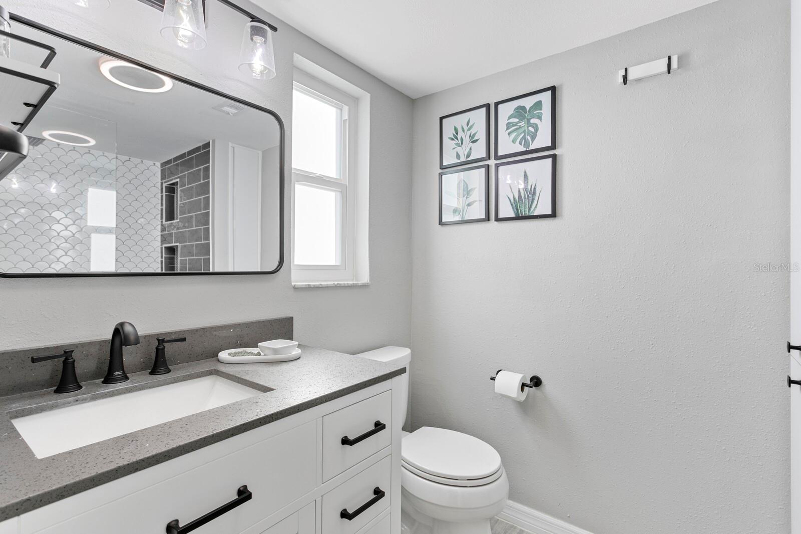 Gorgeous, new primary bath with quartz counters