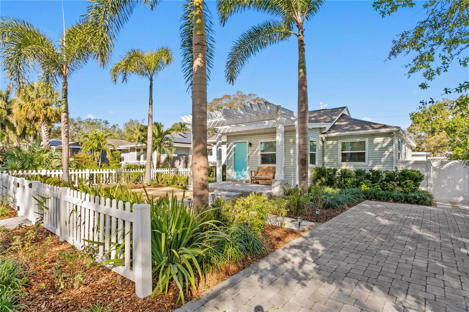 Inviting paver front driveway and landscaping