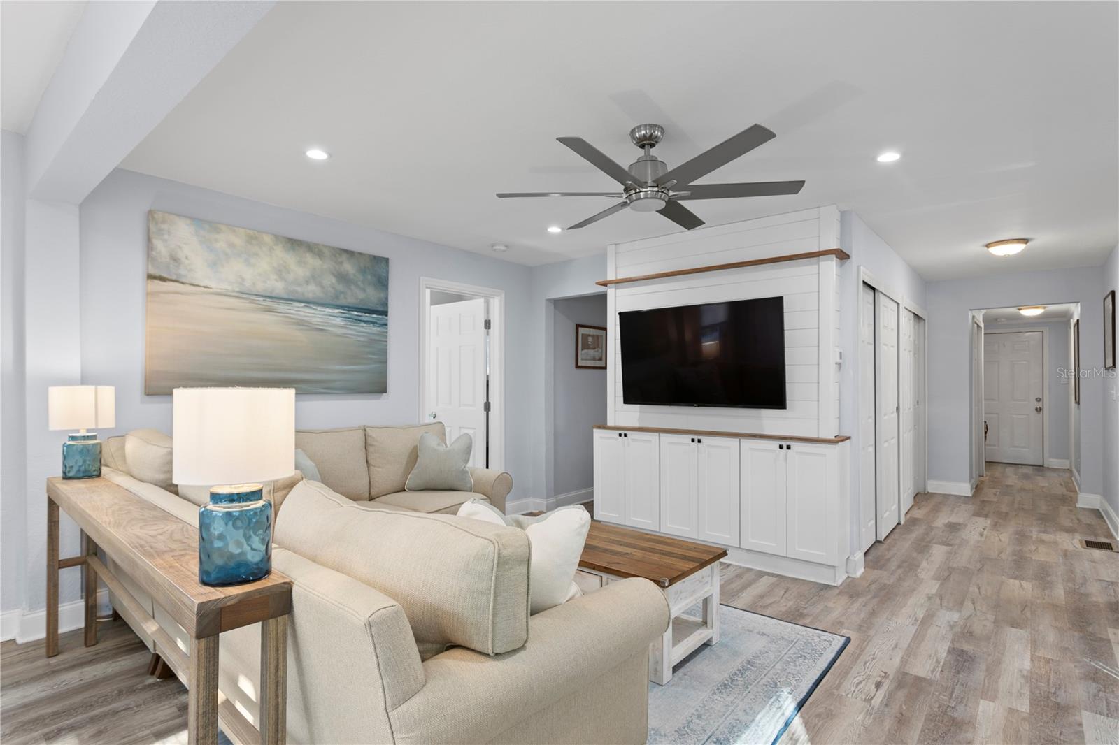 Bright and open floor plan with custom built-in cabinets