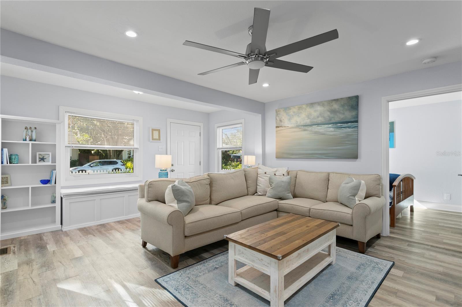 Large foyer with custom built-in cabinet with seat