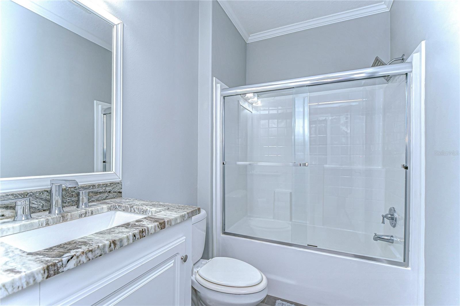 Beautiful bathroom with elegant granite countertops.