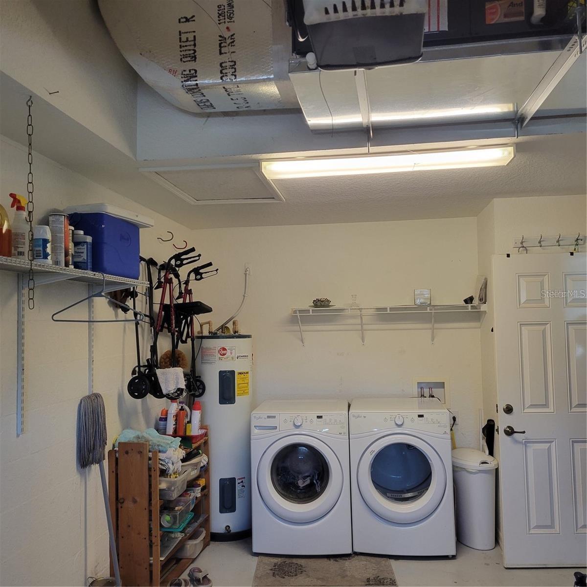 garage with washer n dryer hot water htr