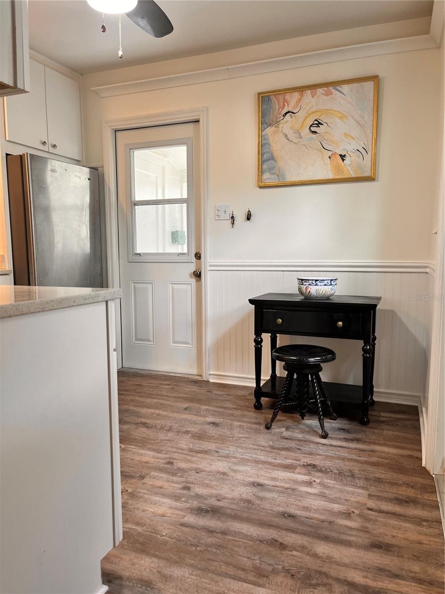 Kitchen with door to outside and laundry room