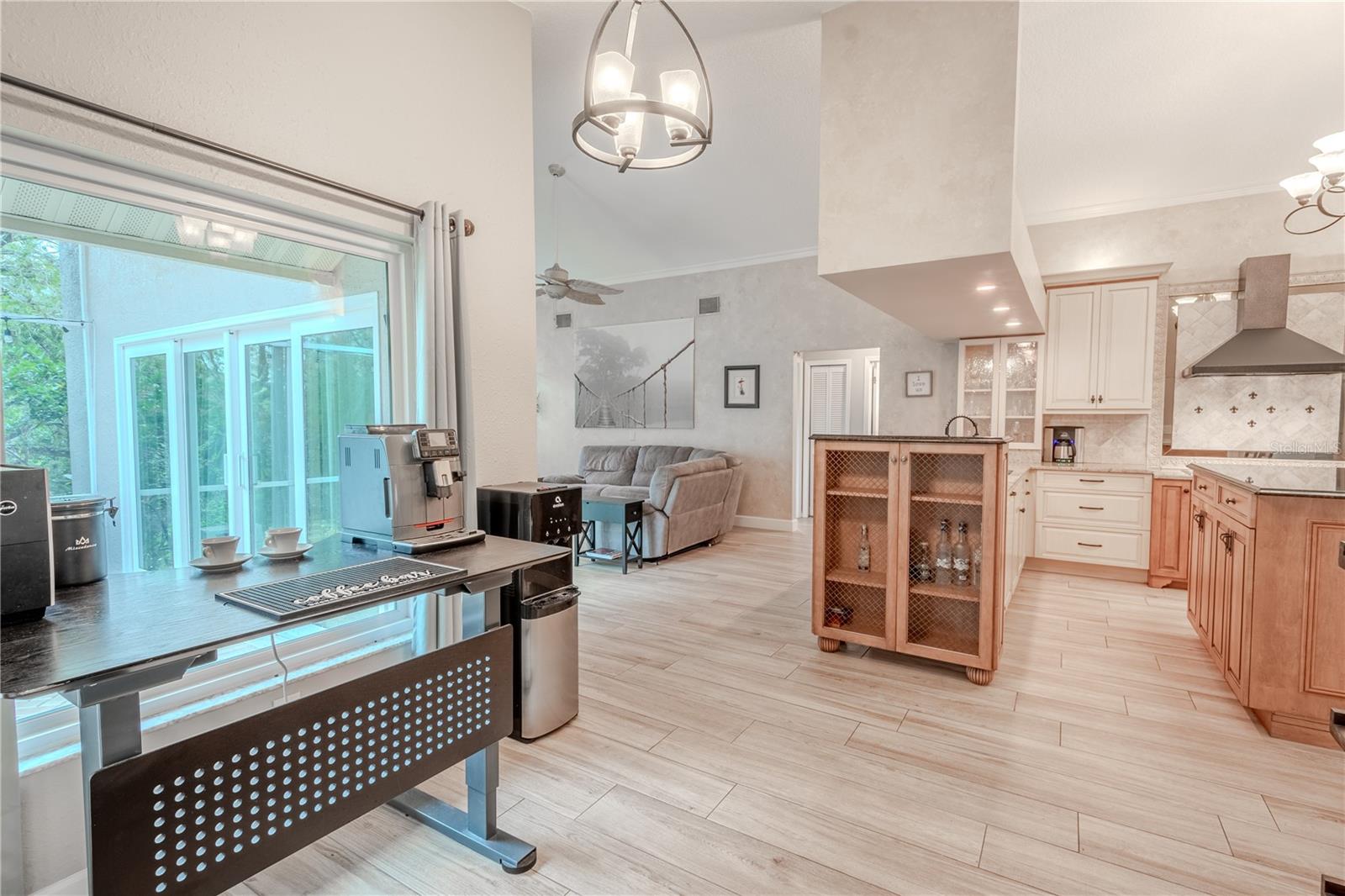 There's a charming breakfast nook with a three bulb pendant light, and picture window.