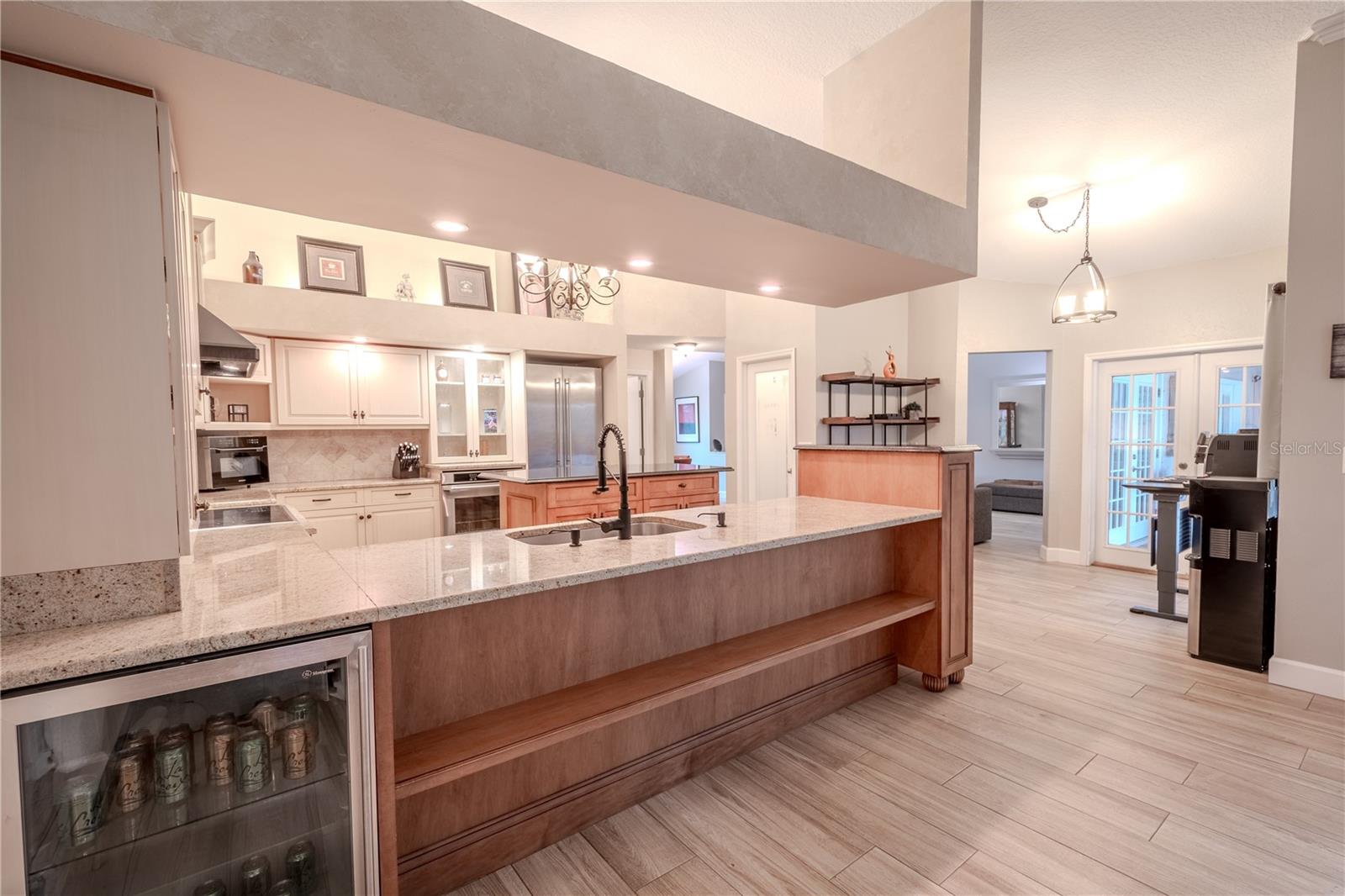 The kitchen has a built-in beverage cooler.