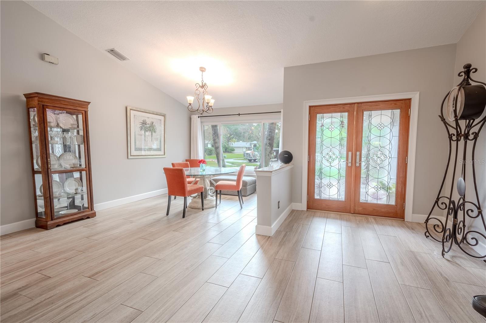 Neutral tones and easy to maintain, wood-like porcelain tile throughout the home.