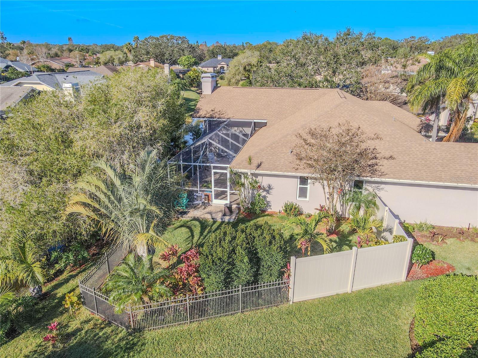 Mature landscaping and fenced in backyard.