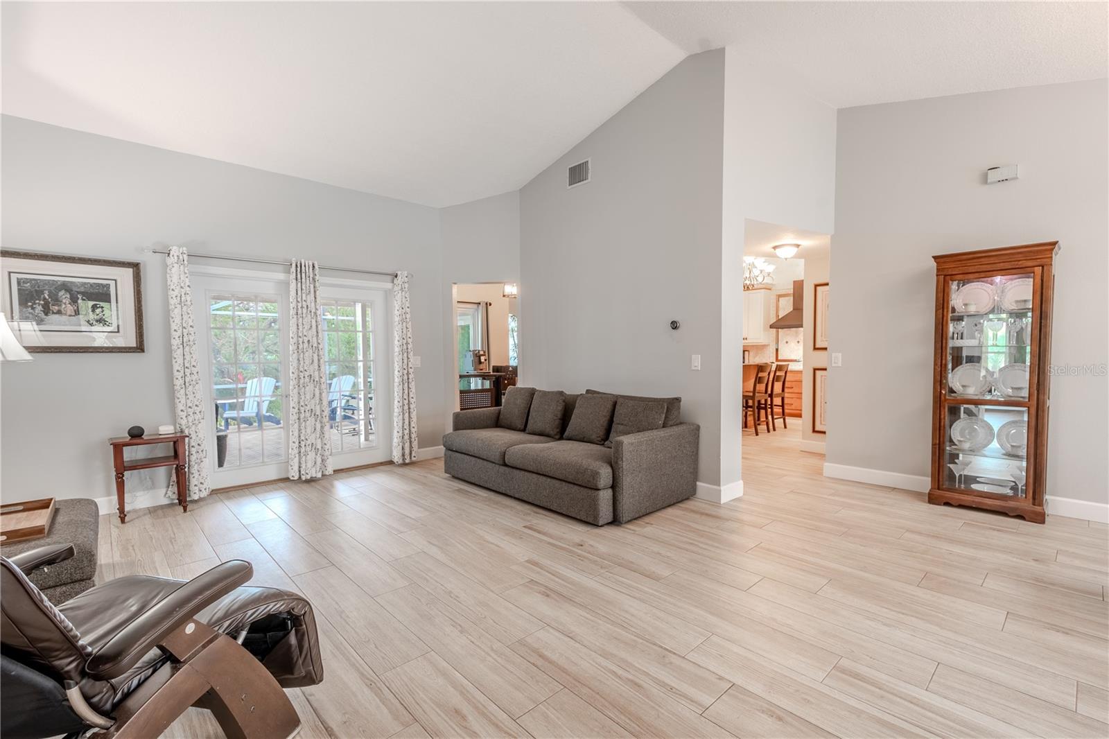 The living room is open to the kitchen and dining room.