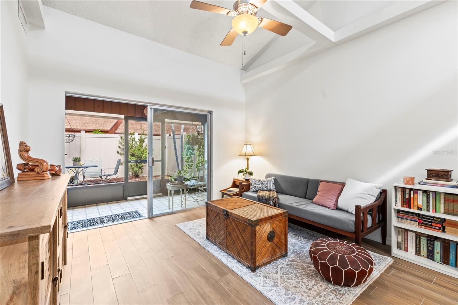 Sliding doors to enclosed patio off living room.