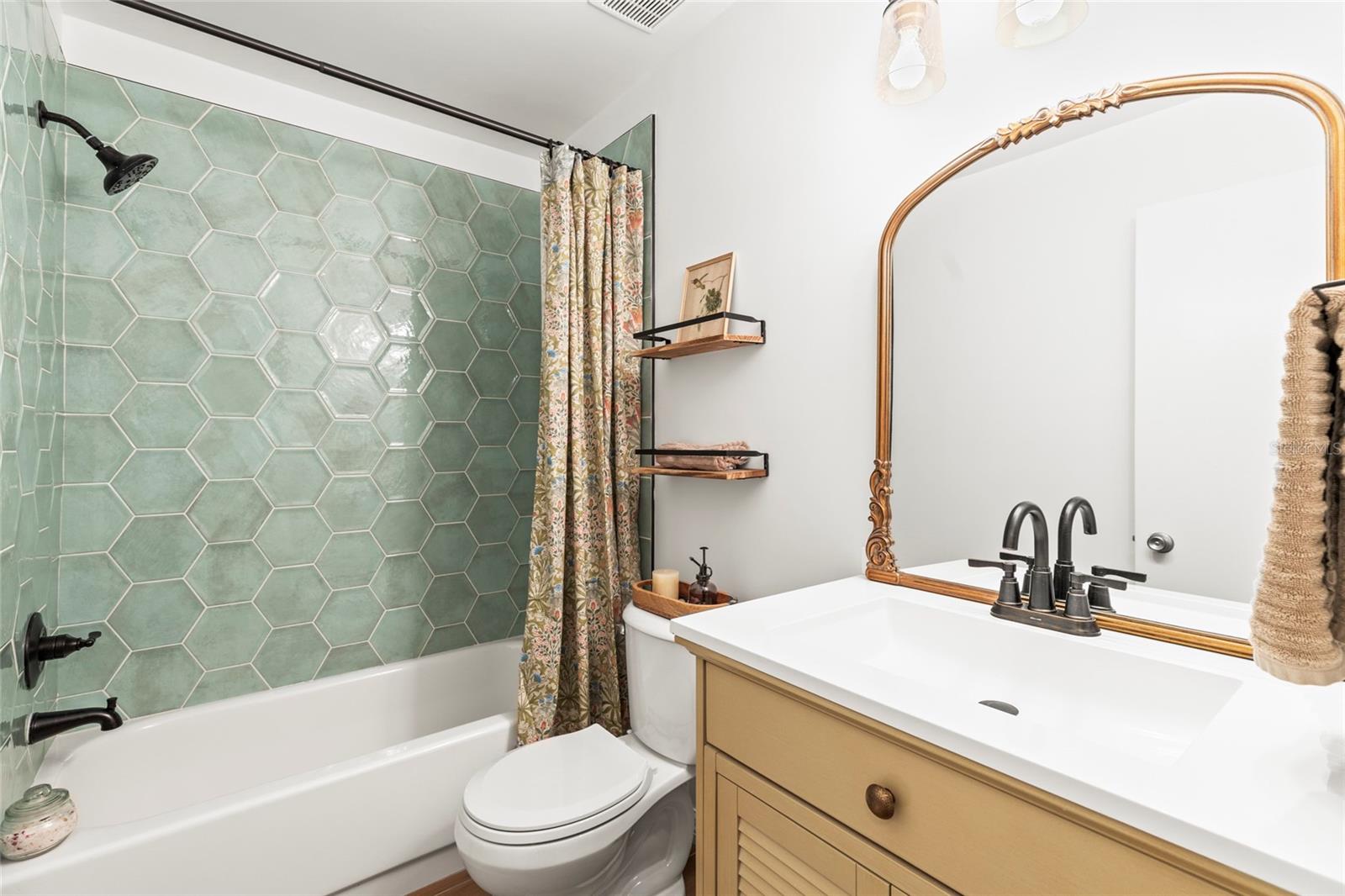 Bathroom was completely renovated with all new walls, flooring, tile, vanity and fixtures. This is the bathroom closest to the second bedroom.