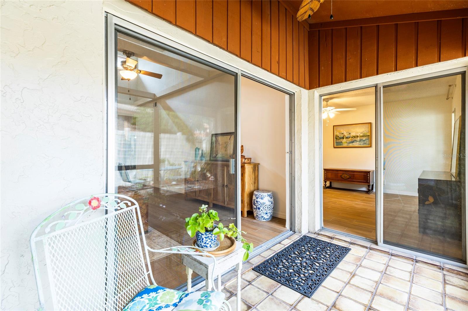 View from enclosed patio with access to living room and primary bedroom.