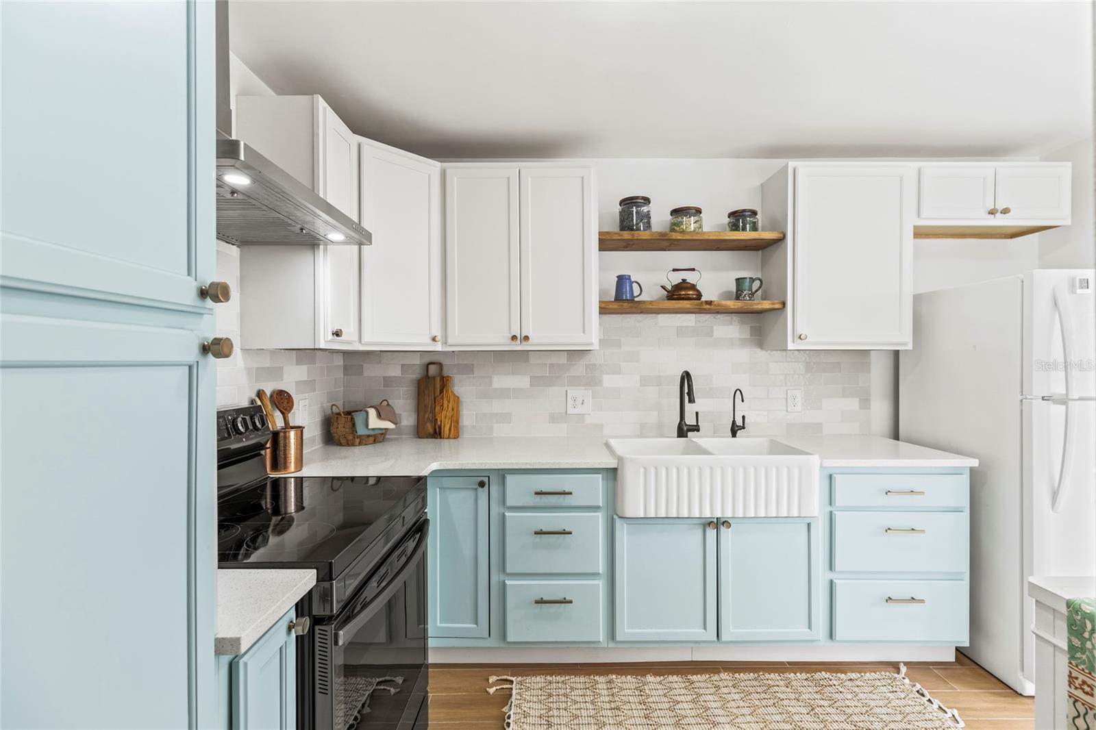 Newly Renovated Kitchen with farmhouse sink and quartz countertops