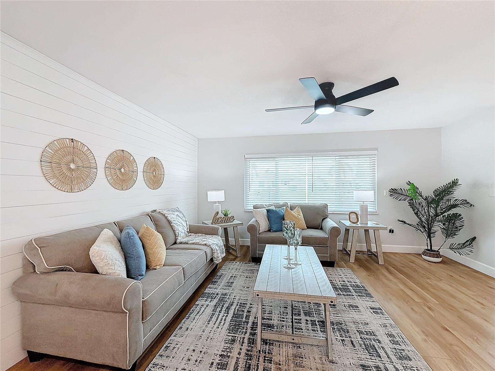 LIVING ROOM BOASTS CUSTOM SHIPLAP WALL