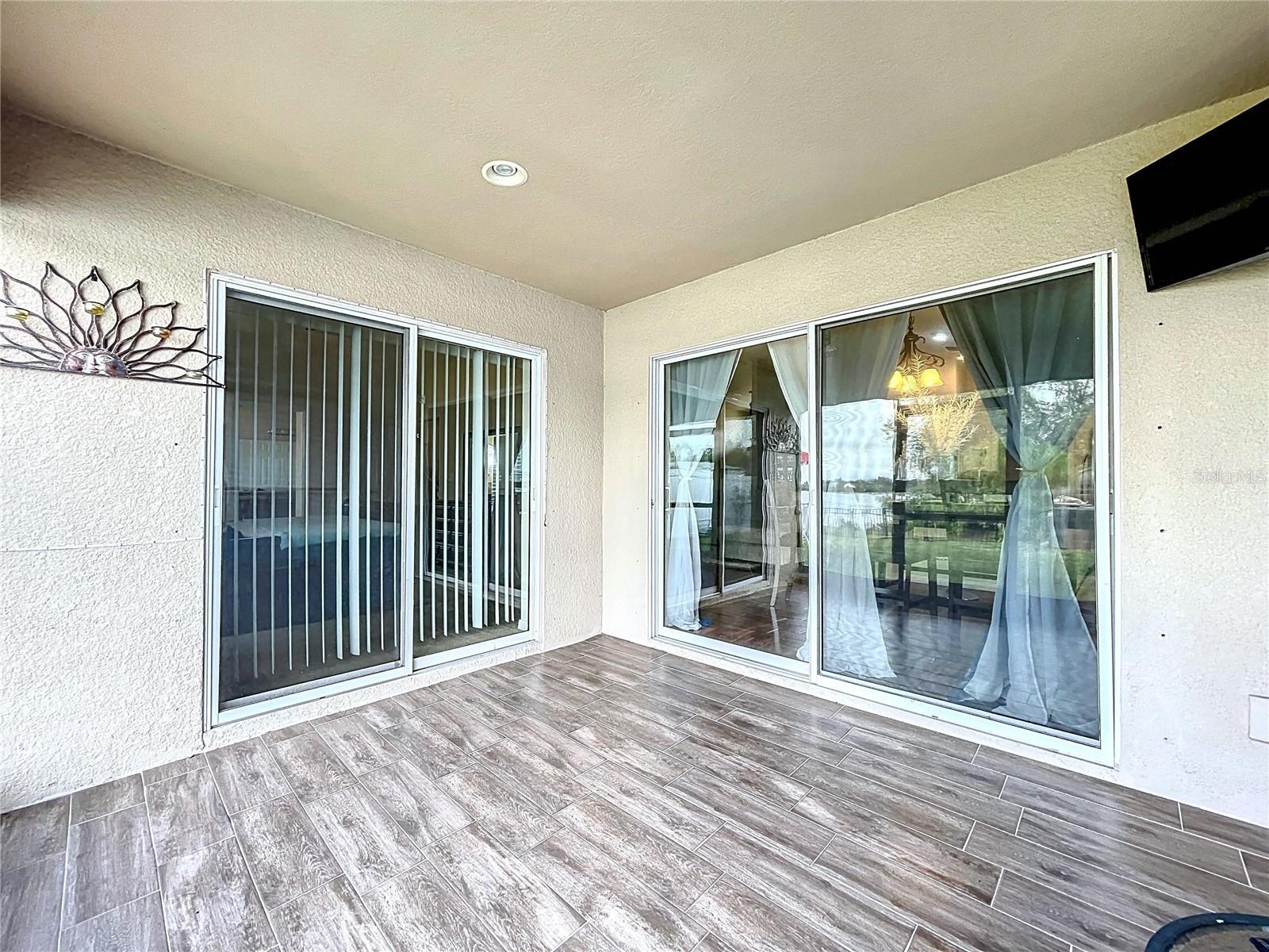 The screened-in lanai with upgraded tileflooring is perfect for unwinding or entertaining.