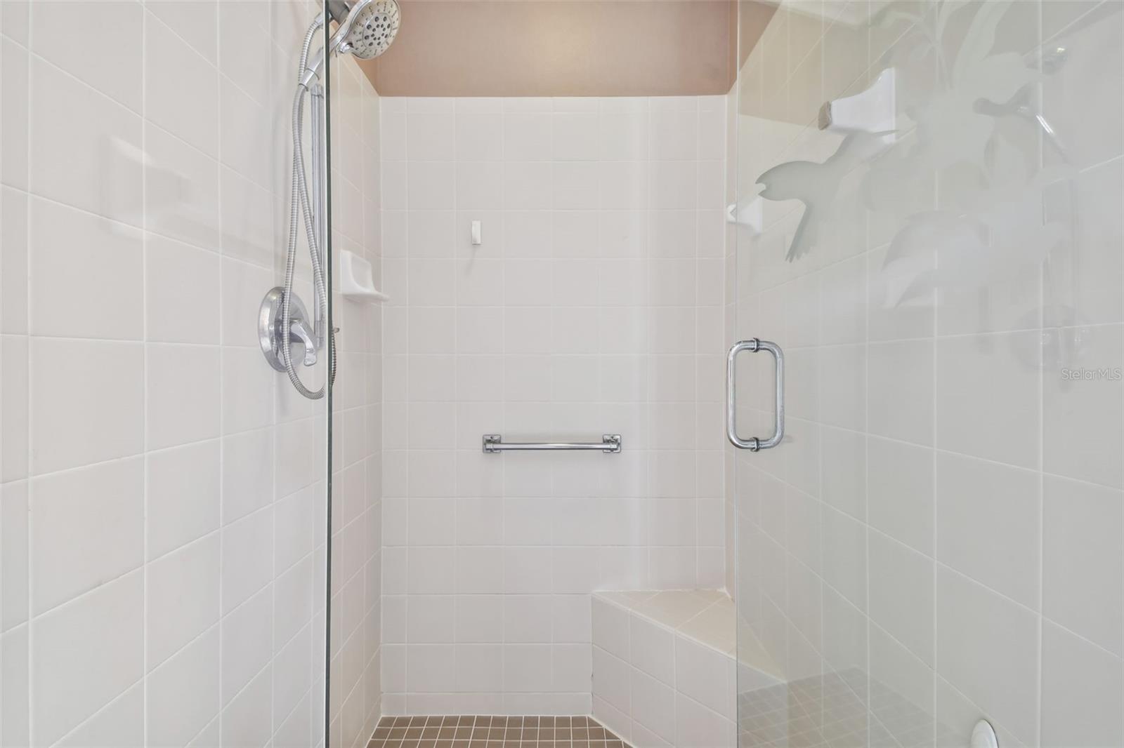 very clean shower with newer shower door