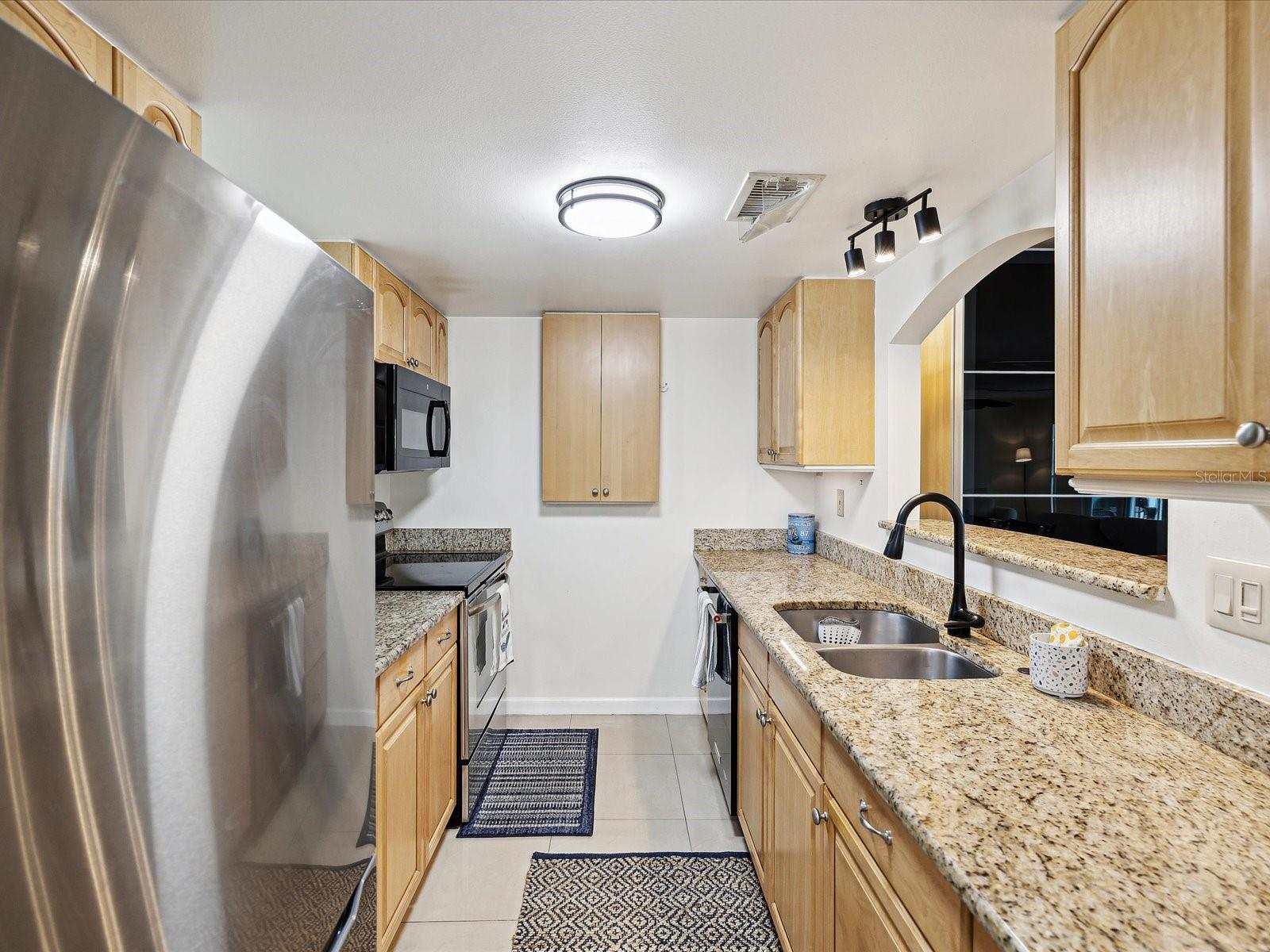 Gleaming Granite Counters & Stainless-Steel Appliances