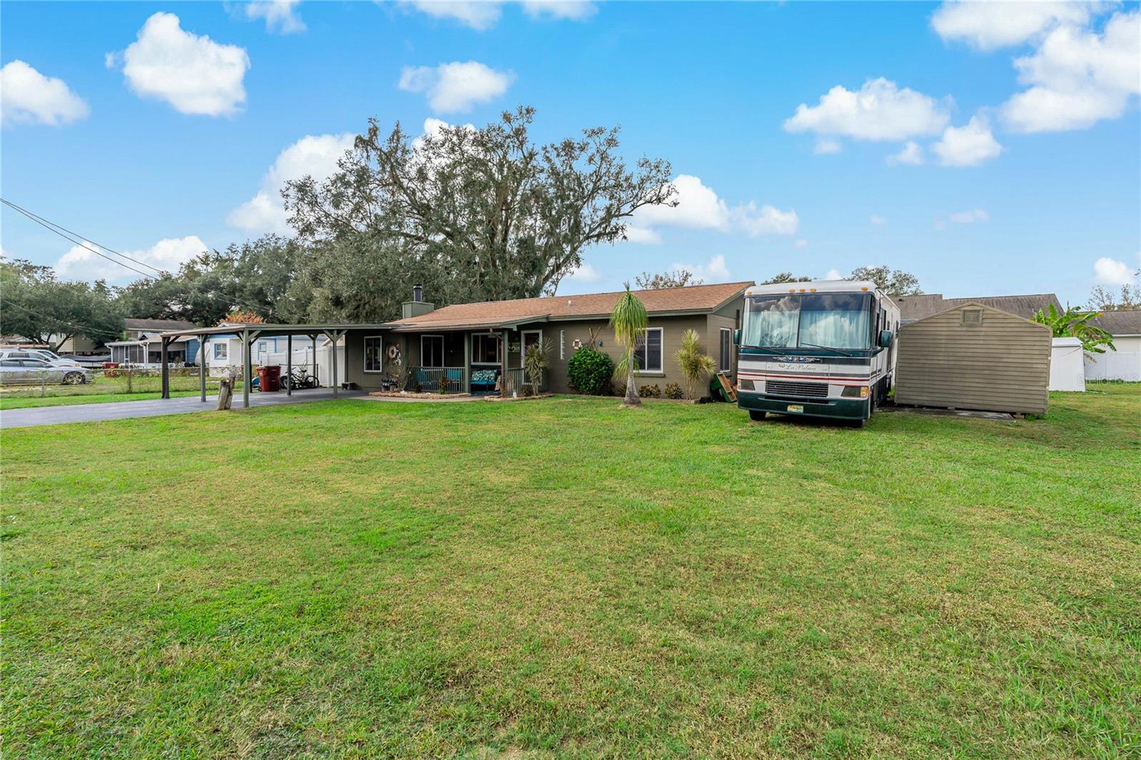 Front Yard with view of 10 ft x 12 ft metal shed on right side of frame