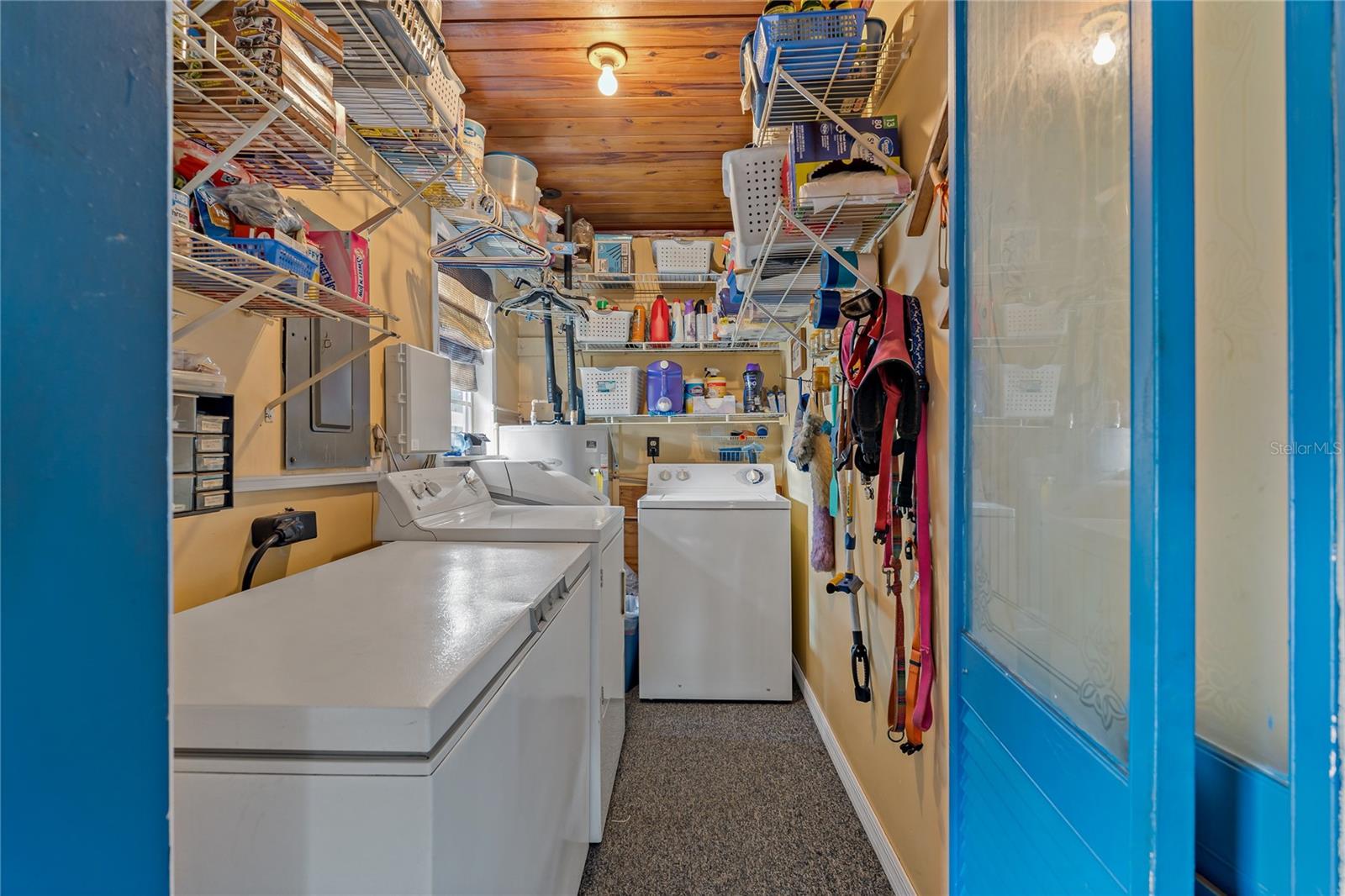 Laundry Room with Water Softener, Hot Water Heater and Washer/Dryer