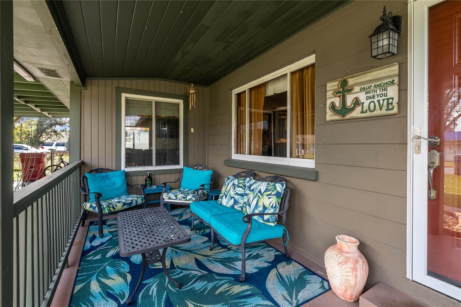 Covered Front Porch.  Window on right is Dining Room.  Window on left is Living Room.