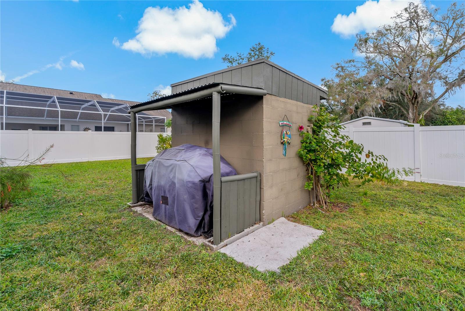 Concrete Block Structure (formerly a well house) with lean-to grill cover