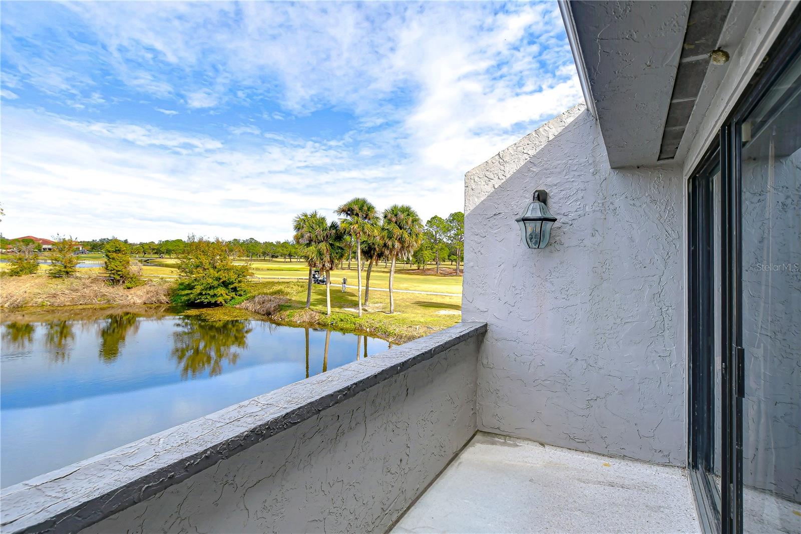 Balcony off primary bedroom w/water view