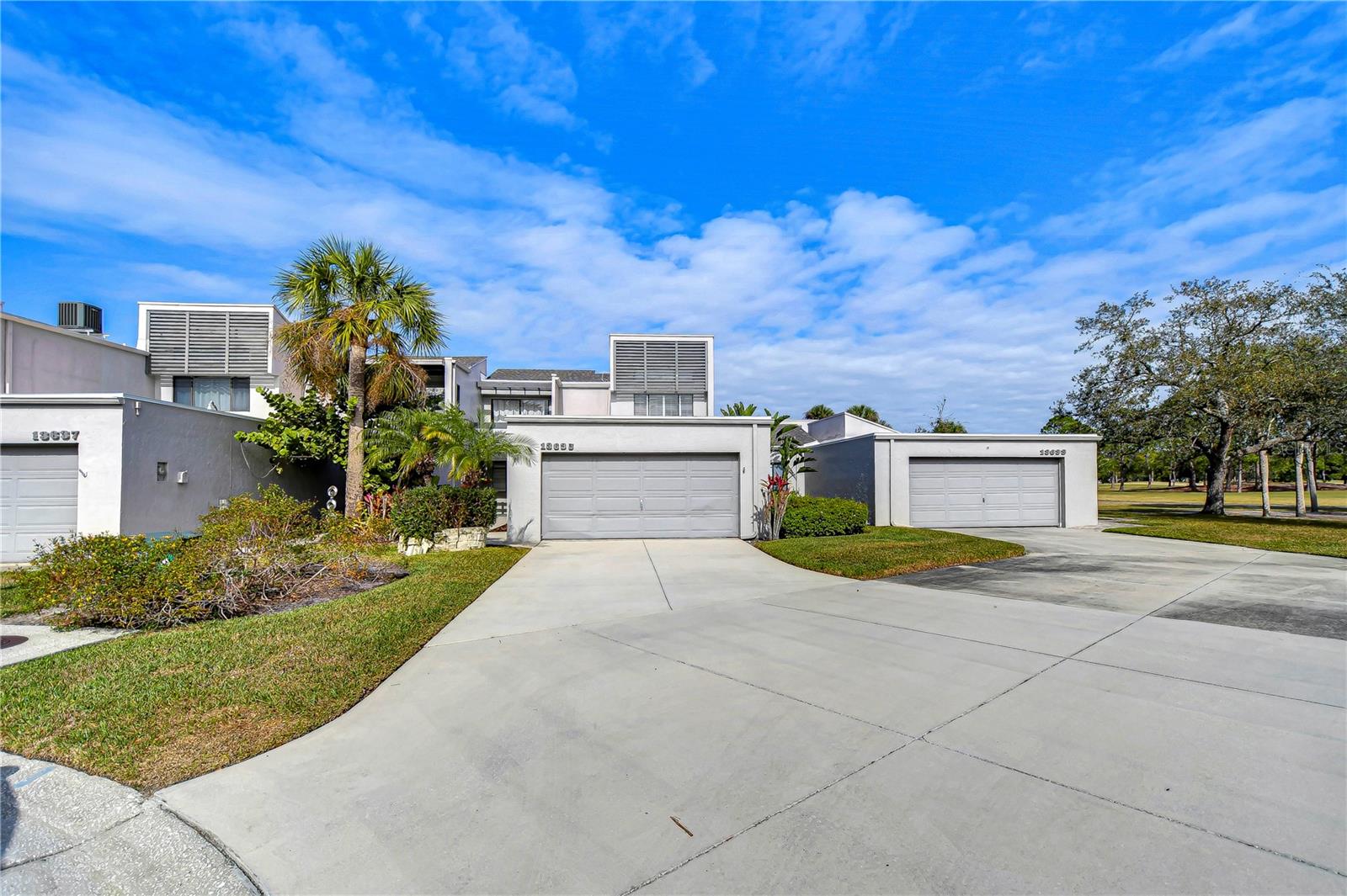 Second unit from right is #13635 with walkway to the right of garage