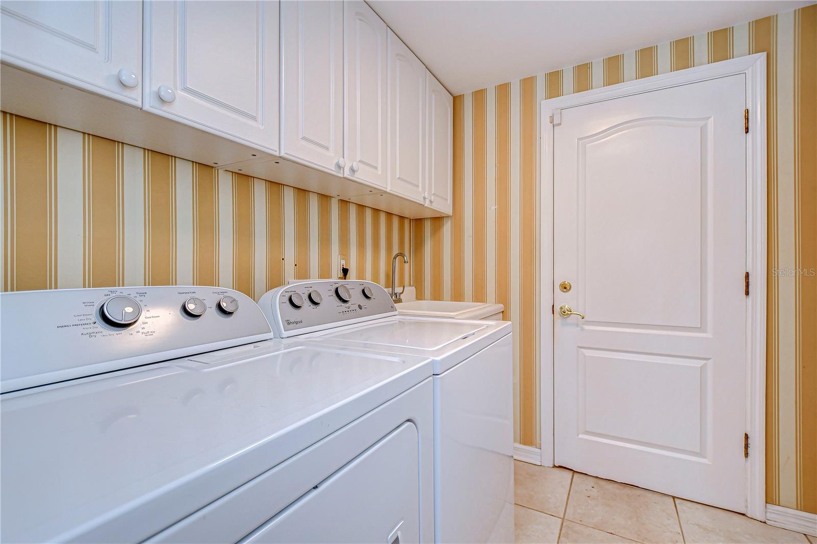 First floor utility room off garage and foyer