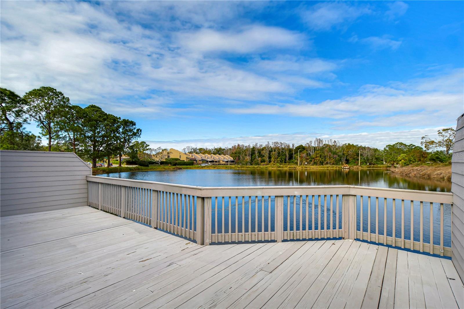 Huge deck overlooking water and golf course